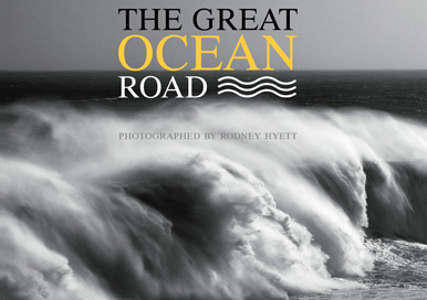 A coffee table book on the Great Ocean Road containing black and white photographs of the coastline as well as historical text and charts.